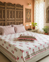 Mridula pink floral pure cotton bedsheet – styled on a bed